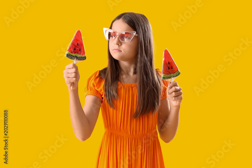Little girl with lollipops ...