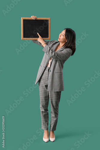 Female Asian teacher pointi...