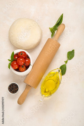 Raw dough and ingredients f...