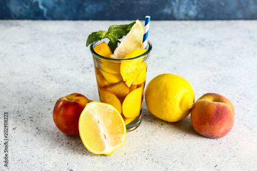 Glass of fresh peach lemona...