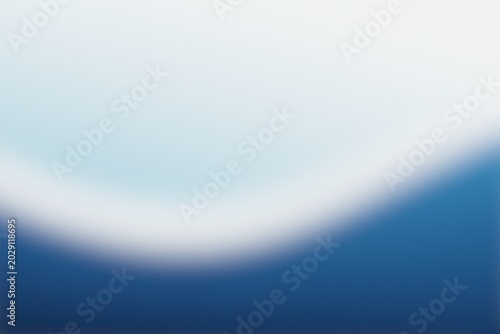 Abstract simple blue blurred gradient background with grainy noise texture
