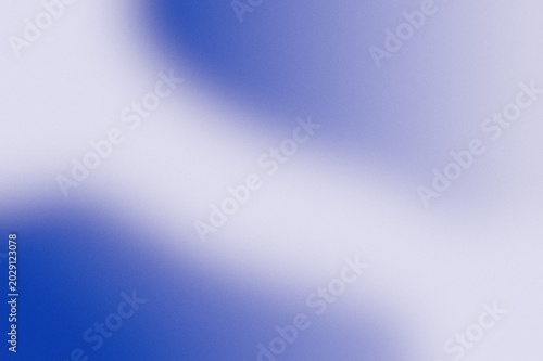 Abstract purple and blue blurred gradient background with grainy noise texture