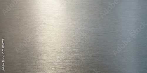 Foto A brushed metal surface with horizontal grain and reflective highlights, showcasing a sleek and modern industrial texture for Website, Background, Branding, Art etc