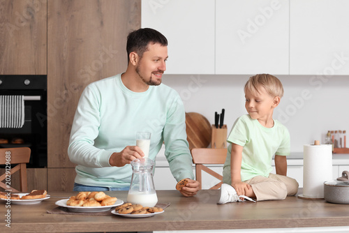 Happy little boy and his fa...