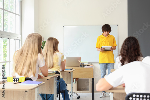 Group of students having lesson in classroom