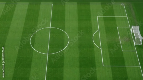 Top View Soccer Field With Striped Green Grass and White Football Pitch Markings
