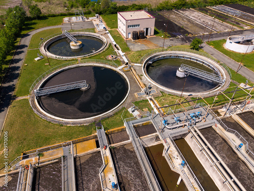 Wastewater treatment facility with multiple tanks and processing area
