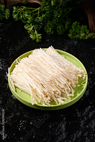 Fresh whole bunches of enoki mushrooms are a great ingredient for hot pot.