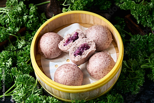 Cut open to reveal the filling of the purple rice and purple sweet potato multigrain bun