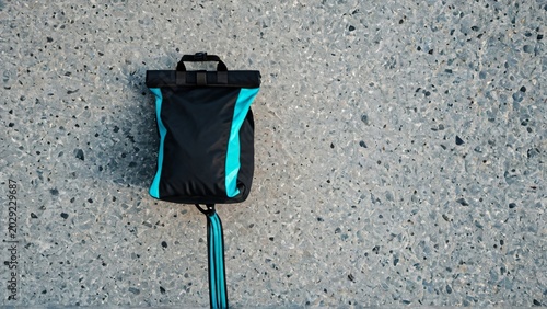 Climbing Chalk Bag and Rope on Granite Texture