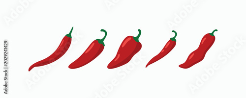 Foto Five red chilies lie in a row