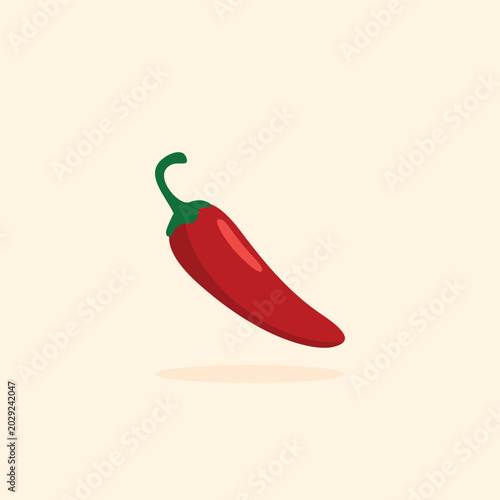 Foto Red chili pepper floats gently against a soft beige backdrop