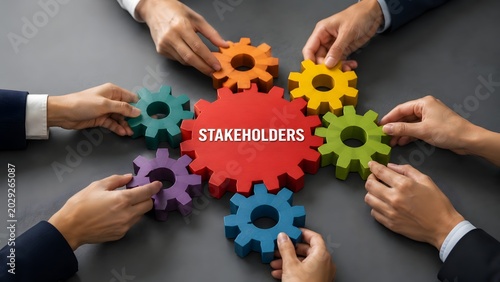 Teamwork and collaboration concept with business people hands connecting colorful gears around a central stakeholders hub, representing corporate synergy.