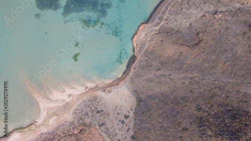 Vászonkép Aerial view of desert coastline and turquoise shallow waters