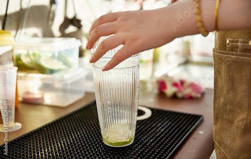 Tableau sur toile Hand-whipped lemon tea being made at the bar counter