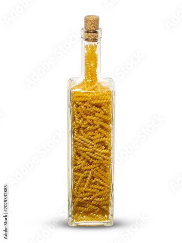 pasta, spirals, taken large, exposed, packed in a transparent square glass bottle