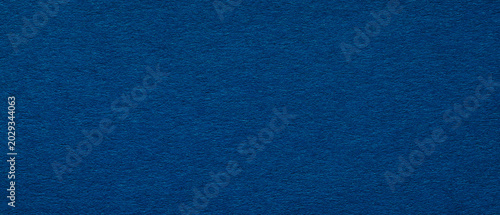 Smooth dark blue paper texture background with subtle fiber detail