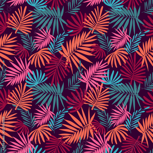 Seamless vector pattern featuring abstract tropical palm leaves in a dense botanical arrangement. Colorful summer and autumn design with silhouettes of fronds in rich shades of deep burgundy, vibrant