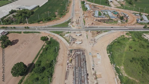 Aerial view drone footage of bridge construction being made across the intersection
