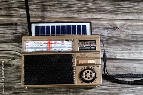 Photos a portable solar-powered AM, FM and SW radio with Bluetooth connectivity and MP3