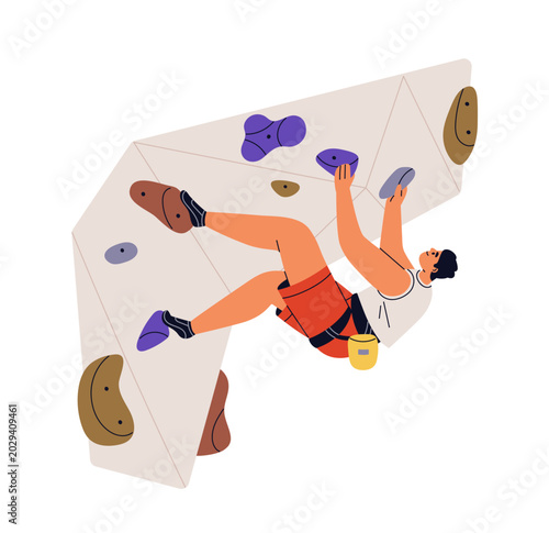 Man climber bouldering on indoor climbing wall with holds, hanging on overhan...