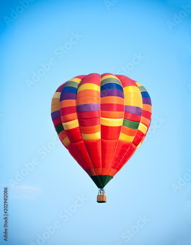 Hot air balloon in the sky. Aeronautics. Against the background of the blue sky. Air sports.