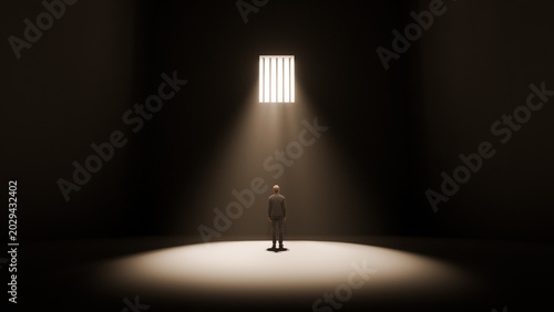 Canvas Print Man standing alone in dark room under barred window with single beam of light, i