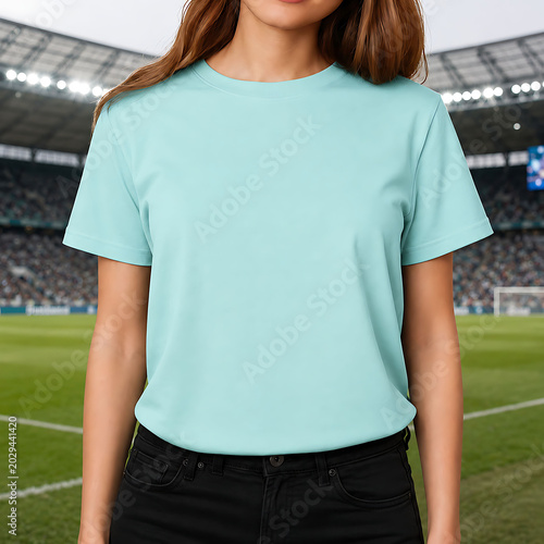 Woman Wearing Blank Aqua T-Shirt In Football Stadium Mockup