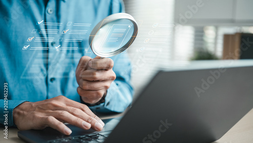 Document audit and verification concept with magnifying glass reviewing digital files and compliance checklist.