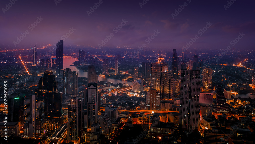 Fototapeta premium City at night with urban buildings. Aerial view, Bangkok< Thailand