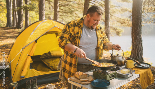 plus size man cooking breakfast at a campsite