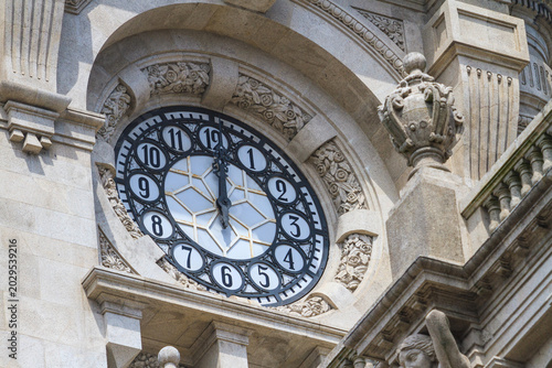 Ornate Historic Clock Tower Detail with Stone Carvings Close Up Porto Portugal