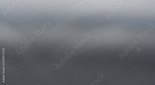 Abstract gradient background with smooth transitions of gray tones.