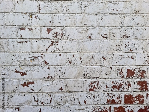 Weathered White Brick Wall Background with Flaking and Peeling Paint
