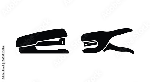 Foto Black office stapler and staple remover silhouette on a white background