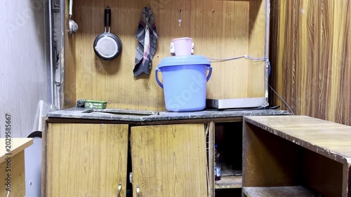 Depleted Office Kitchen Showing Poor Maintenance, Worn Workplace Pantry, Unclean Interior, Corporate Neglect and Hygiene Issues Environment Scene
