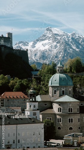 Salzburg historic old town against snowcapped Untersberg mountain in springtime, Salzburg Land, Austria