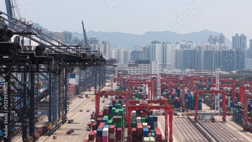 Large Container Terminal With Colorful Shipping Containers and Cranes Operating in a Hong Kong Logistics Hub, Symbolizing International Trade and Global Supply Chains. Container Terminal Handling