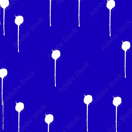 White paint splatters on royal blue background seamless pattern