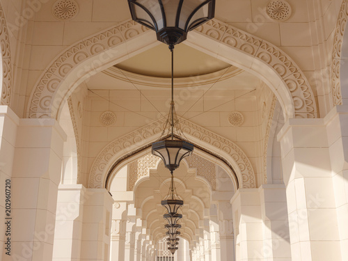 Elegant exterior showcases traditional Arabic design elements with ornate arches and decorative lanterns. White marble walls and geometric patterns create authentic oriental atmosphere
