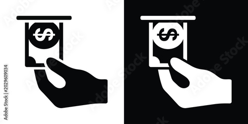 Fotografie Hand withdrawing or inserting dollar cash into slot vector icon