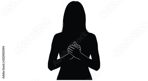 Fotografia Woman praying with hands clasped together silhouette