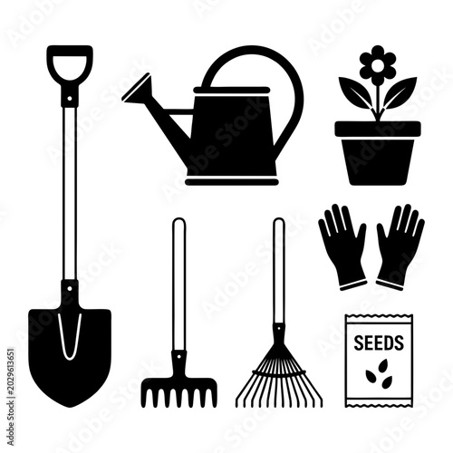 Gardening tools and supplies arranged neatly on a surface include shovel, watering can.