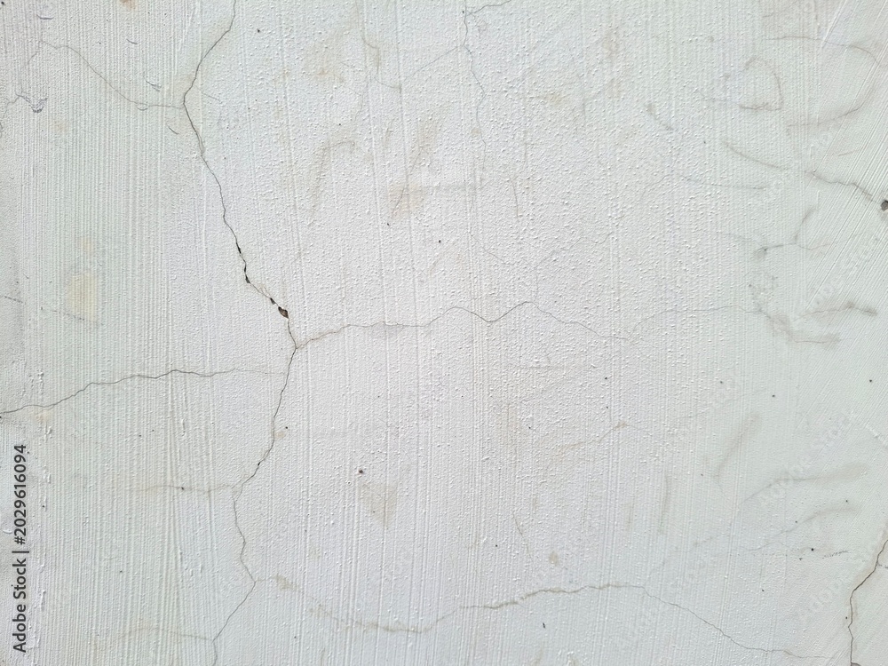 Fototapeta premium White cracked concrete wall background texture
