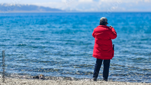 Photos Beautiful scenic view of Sayram Lake with turquoise water and snow-capped Tiansh