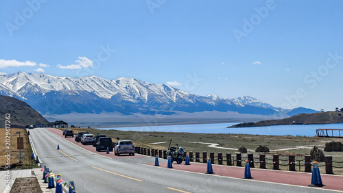 Tableau sur toile Beautiful scenic view of Sayram Lake with turquoise water and snow-capped Tiansh