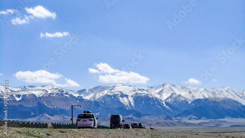 Bilde på lerret Beautiful scenic view of Sayram Lake with turquoise water and snow-capped Tiansh