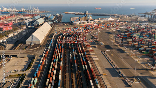 Fotografía Drone view of shipping containers rail yard and industrial harbor