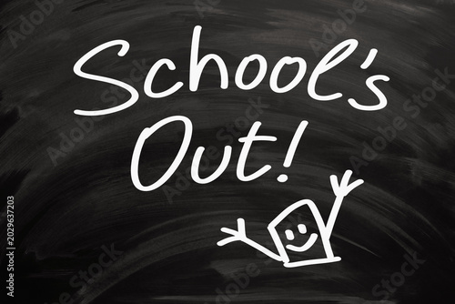 Phrase School Is Out Handwritten On Blackboard