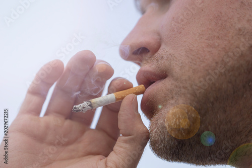Photos man smoking cigarette bad habit addiction close up face exhale smoke unhealth li